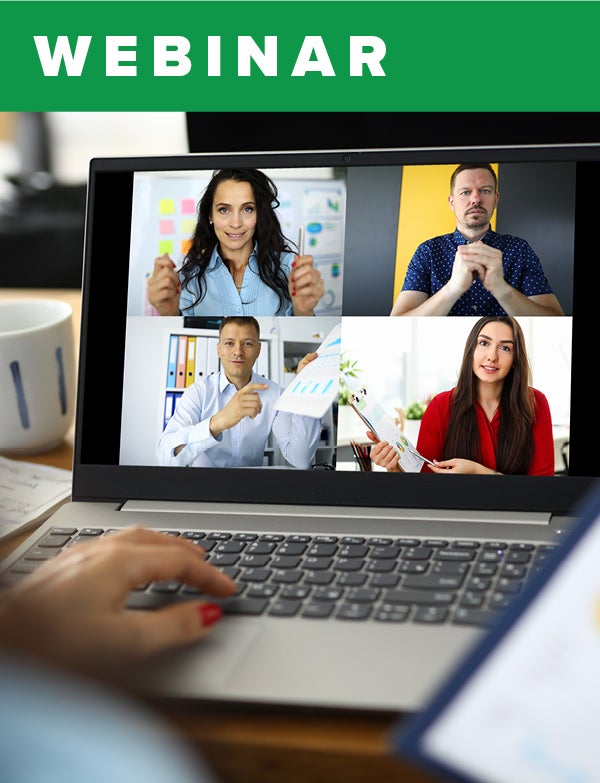 An open laptop displaying four videos from a video call. 