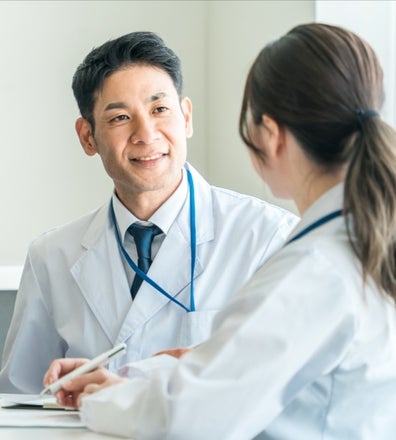 A man and woman in white coats